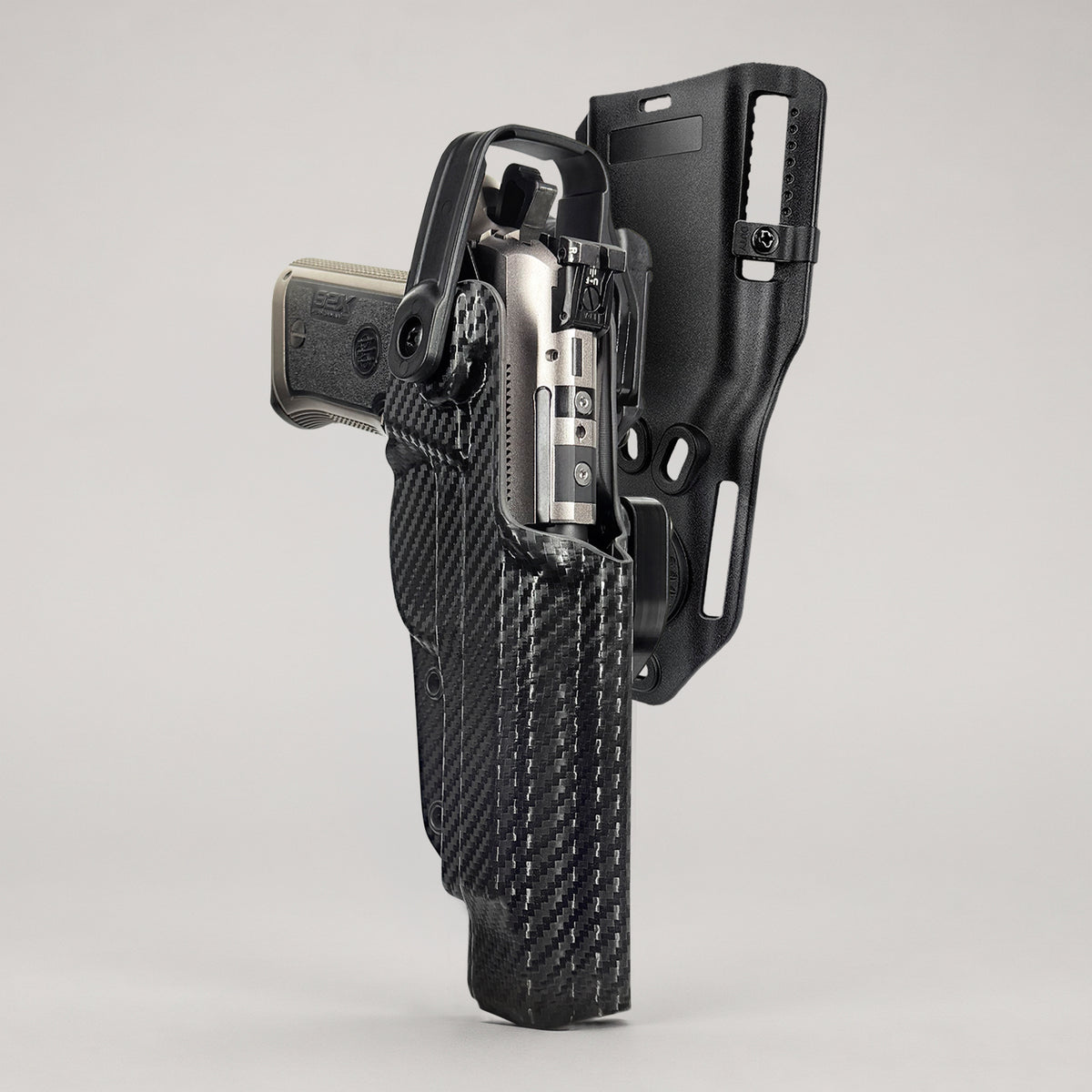 Beretta 92X Performance holstered in a level 2 holster with locking lever and belt attachment