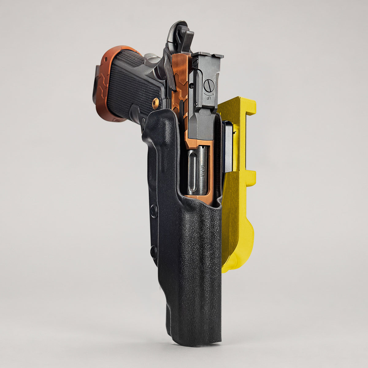 IDPA Quick Mount Holster featuring the Kimber 2K11 with Gold belt attachment and black kydex shell