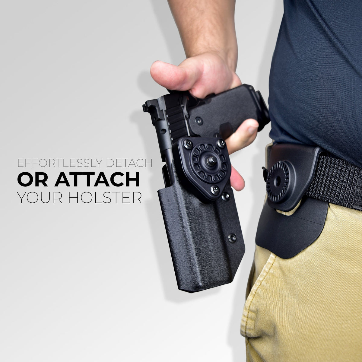 Quick Release Paddle Holster: effortlessly detach or attach your holsters. A hand lifts the holstered pistol off the paddle attachment.